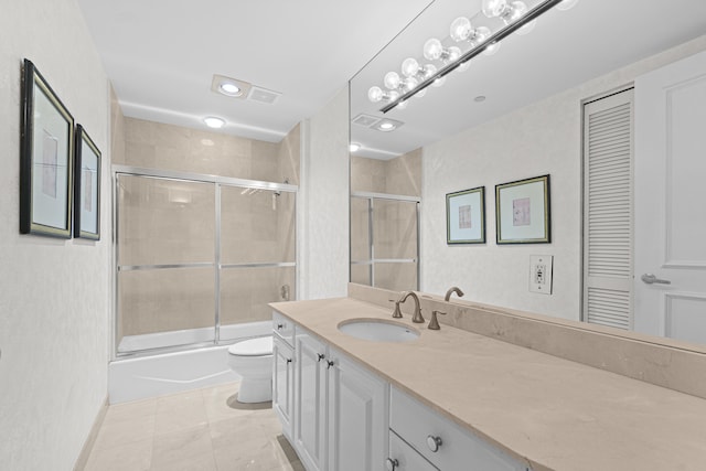 800 Ocean Dr Unit 204, Juno Beach, FL 33408 - full bathroom with toilet, vanity, shower / bath combination with glass door, a closet, and tile patterned floors