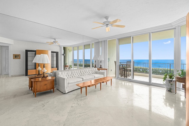 800 Ocean Dr Unit 204, Juno Beach, FL 33408 - living room featuring floor to ceiling windows, ceiling fan, and a water view