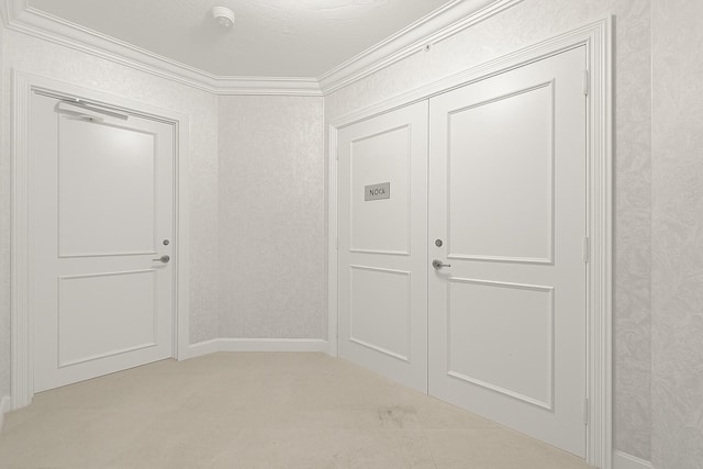 800 Ocean Dr Unit 204, Juno Beach, FL 33408 - foyer entrance with crown molding, carpet floors, and baseboards