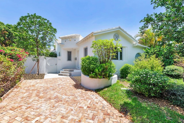 711 Ardmore Rd, West Palm Beach, FL 33401 - mediterranean / spanish house with stucco siding and a gate