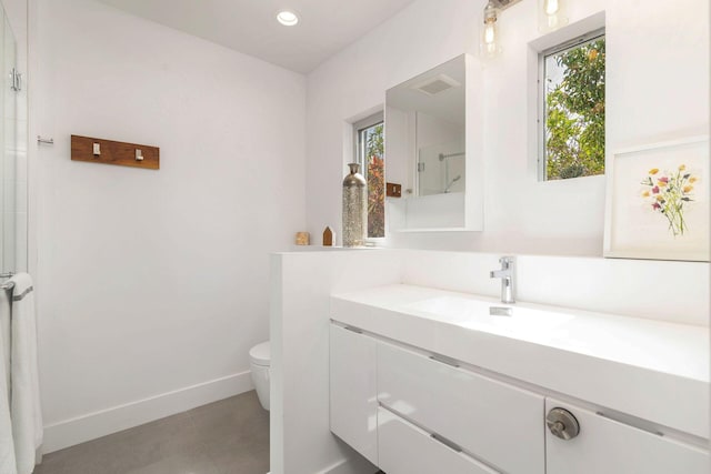 711 Ardmore Rd, West Palm Beach, FL 33401 - full bath with vanity, toilet, baseboards, an enclosed shower, and tile patterned floors