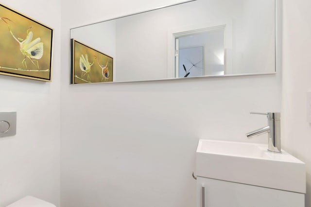711 Ardmore Rd, West Palm Beach, FL 33401 - half bathroom with toilet and vanity