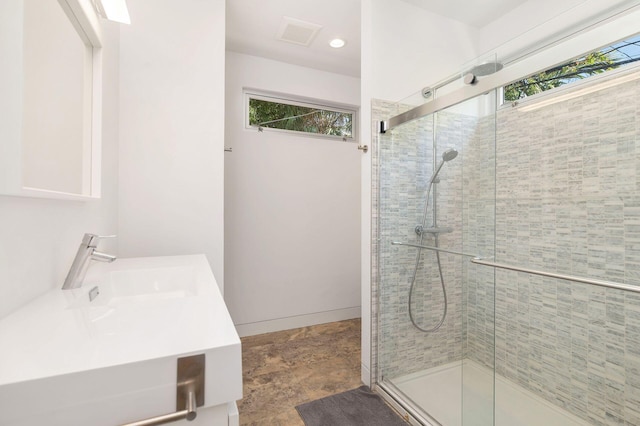 711 Ardmore Rd, West Palm Beach, FL 33401 - bathroom featuring a shower stall, vanity, baseboards, and recessed lighting