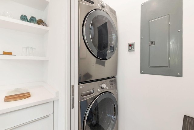 711 Ardmore Rd, West Palm Beach, FL 33401 - laundry room featuring stacked washer / drying machine and electric panel