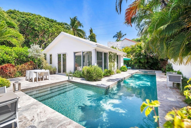 711 Ardmore Rd, West Palm Beach, FL 33401 - view of pool featuring an exterior structure, a patio, an outbuilding, and outdoor dining area