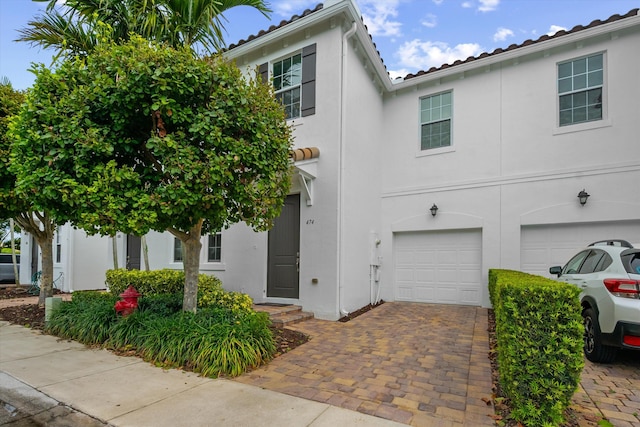 474 Francesca Ridge Rd, Boynton Beach, FL 33435 - view of front of house featuring a garage, stucco siding, and decorative driveway