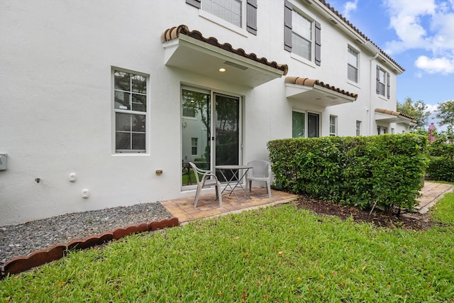 474 Francesca Ridge Rd, Boynton Beach, FL 33435 - rear view of property with a tiled roof, stucco siding, a yard, and a patio area