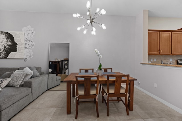 474 Francesca Ridge Rd, Boynton Beach, FL 33435 - dining area with a chandelier, light tile patterned floors, and baseboards