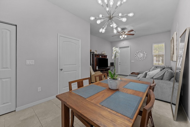 474 Francesca Ridge Rd, Boynton Beach, FL 33435 - dining room with a ceiling fan, a chandelier, baseboards, and light tile patterned floors