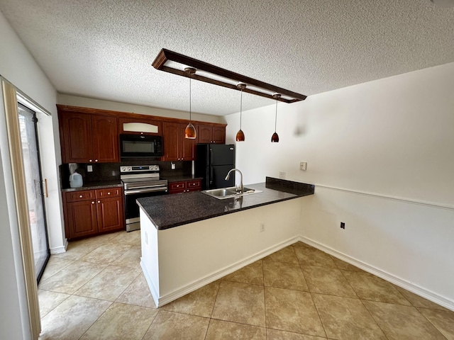 6006 60th Way, West Palm Beach, FL 33409 - kitchen featuring black appliances, a sink, a peninsula, dark countertops, and a textured ceiling