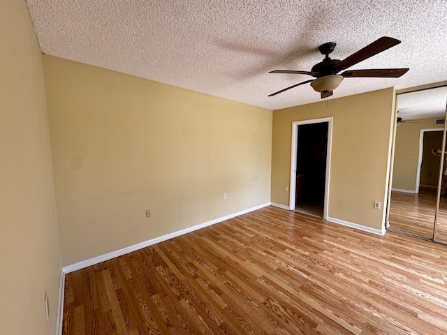 6006 60th Way, West Palm Beach, FL 33409 - unfurnished room with a ceiling fan, light wood finished floors, a textured ceiling, and baseboards