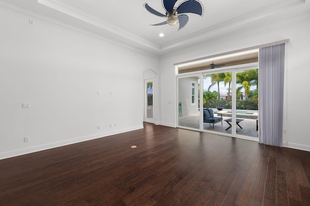 18006 SW Cosenza Way, Port Saint Lucie, FL 34987 - spare room with a ceiling fan, ornamental molding, hardwood / wood-style floors, arched walkways, and baseboards