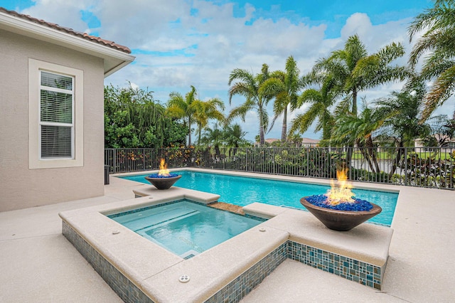 18006 SW Cosenza Way, Port Saint Lucie, FL 34987 - view of pool featuring an in-ground hot tub, a fenced backyard, and a patio area