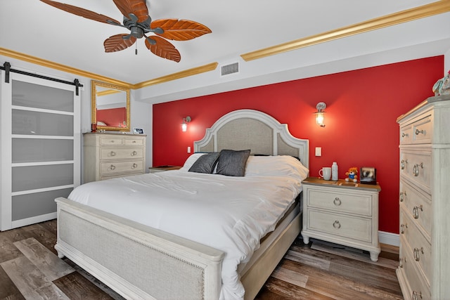 1508 15th Ter, Palm Beach Gardens, FL 33418 - bedroom featuring wood finished floors, a barn door, and a ceiling fan