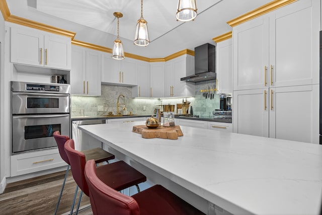 1508 15th Ter, Palm Beach Gardens, FL 33418 - kitchen featuring wall chimney exhaust hood, appliances with stainless steel finishes, decorative backsplash, hanging light fixtures, and dark wood-style floors