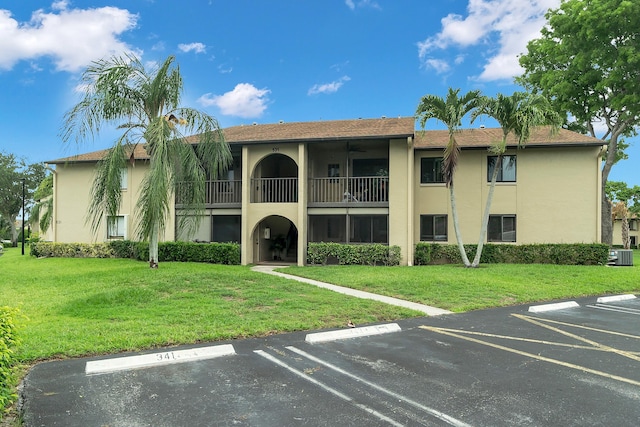 531 Shady Pine Way Unit A 2, Greenacres, FL 33415 - view of building exterior featuring uncovered parking and central AC