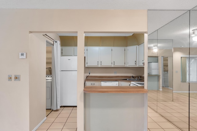 531 Shady Pine Way Unit A 2, Greenacres, FL 33415 - kitchen featuring white appliances, light tile patterned floors, a sink, and washer / clothes dryer
