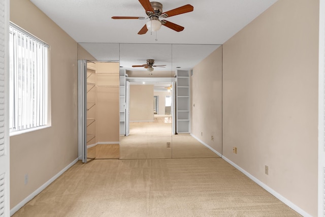 531 Shady Pine Way Unit A 2, Greenacres, FL 33415 - hallway with light colored carpet, plenty of natural light, and baseboards