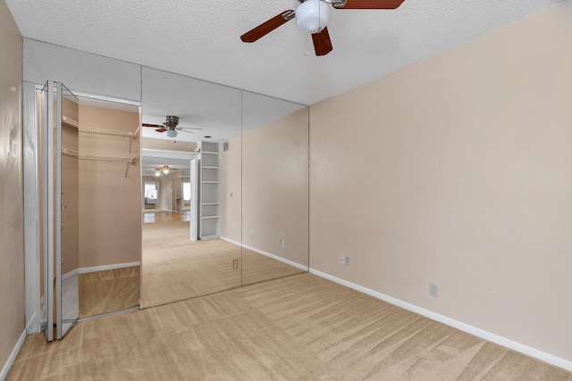 531 Shady Pine Way Unit A 2, Greenacres, FL 33415 - unfurnished bedroom with carpet flooring, baseboards, a textured ceiling, and ceiling fan