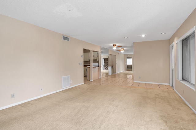 531 Shady Pine Way Unit A 2, Greenacres, FL 33415 - unfurnished living room featuring light colored carpet, baseboards, recessed lighting, a ceiling fan, and light tile patterned flooring