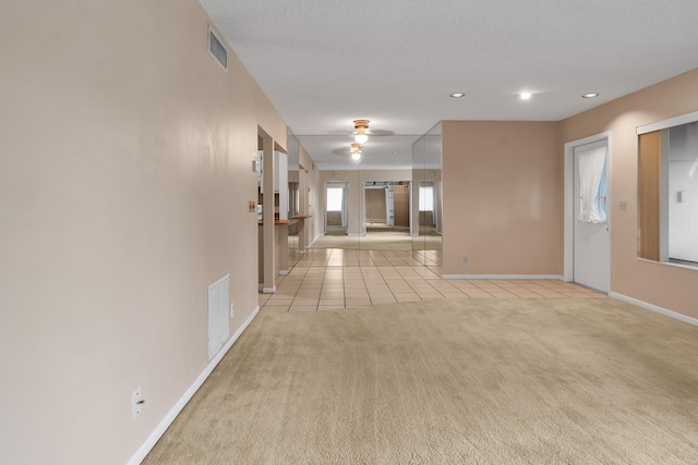 531 Shady Pine Way Unit A 2, Greenacres, FL 33415 - hall with baseboards, light tile patterned floors, light carpet, and recessed lighting