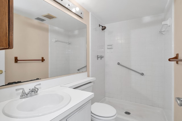 531 Shady Pine Way Unit A 2, Greenacres, FL 33415 - bathroom featuring toilet, vanity, and a tile shower