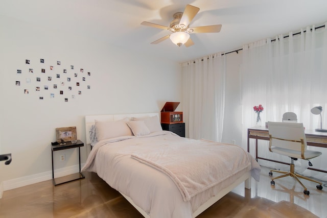 1026 Center Stone Ln, Riviera Beach, FL 33404 - bedroom with a ceiling fan and wood finished floors