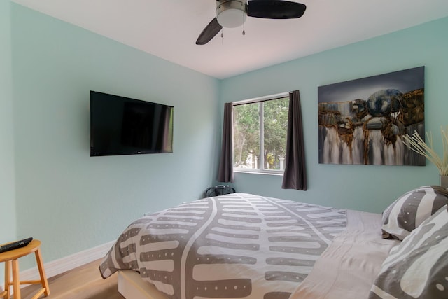 1026 Center Stone Ln, Riviera Beach, FL 33404 - bedroom with wood finished floors and a ceiling fan