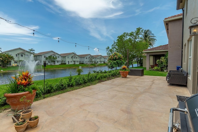 1026 Center Stone Ln, Riviera Beach, FL 33404 - view of patio with a residential view and a water view