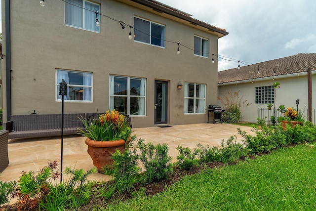 1026 Center Stone Ln, Riviera Beach, FL 33404 - back of property with a patio and stucco siding
