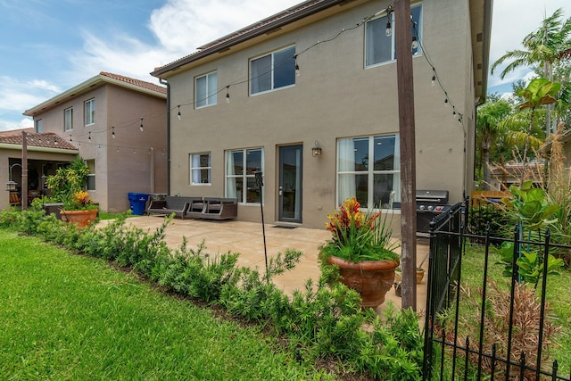 1026 Center Stone Ln, Riviera Beach, FL 33404 - back of house featuring a patio and stucco siding