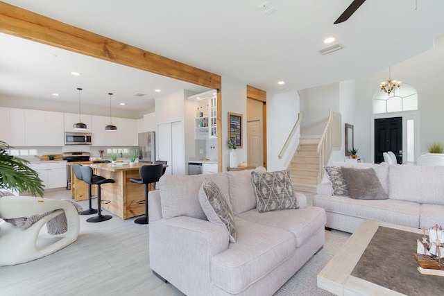 1026 Center Stone Ln, Riviera Beach, FL 33404 - living area with light wood finished floors, stairs, recessed lighting, ceiling fan, and a chandelier