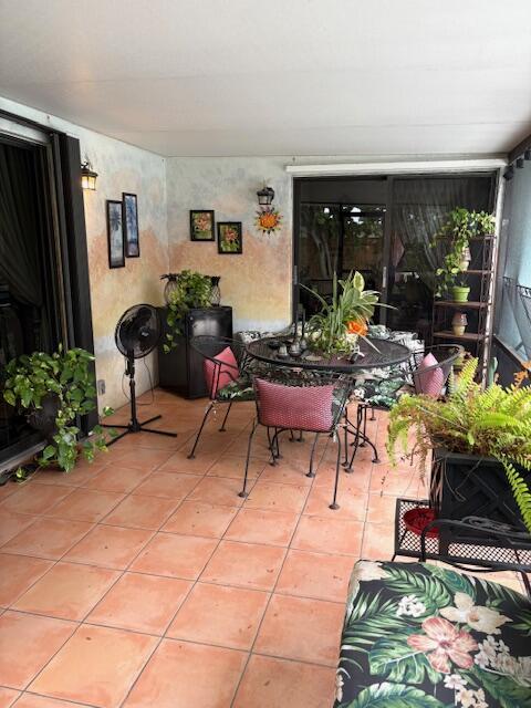 729 W Kalmia Dr, Lake Park, FL 33403 - view of patio featuring outdoor dining area