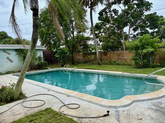 729 W Kalmia Dr, Lake Park, FL 33403 - view of pool featuring a fenced backyard