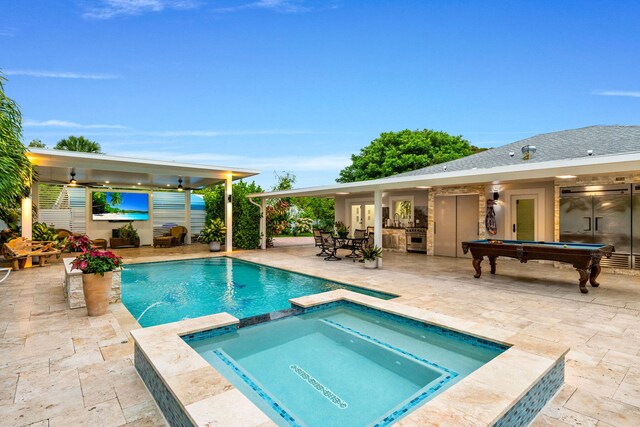 936 Upland Rd, West Palm Beach, FL 33401 - view of swimming pool featuring a patio and a pool with connected hot tub