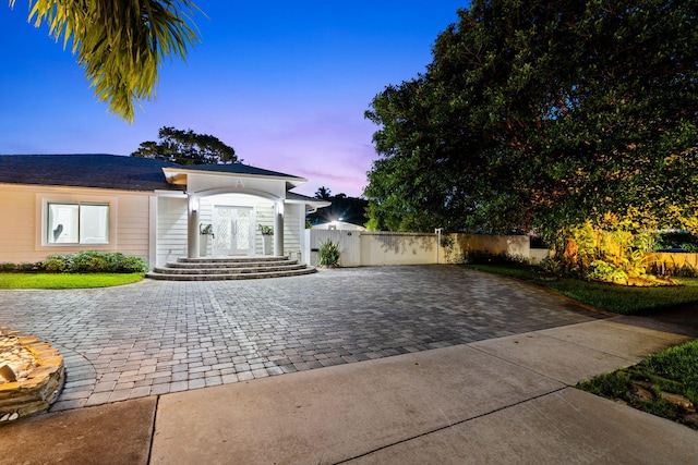 936 Upland Rd, West Palm Beach, FL 33401 - view of front of home with decorative driveway and french doors