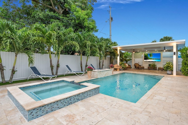 936 Upland Rd, West Palm Beach, FL 33401 - view of swimming pool featuring a patio, a fenced backyard, and a pool with connected hot tub