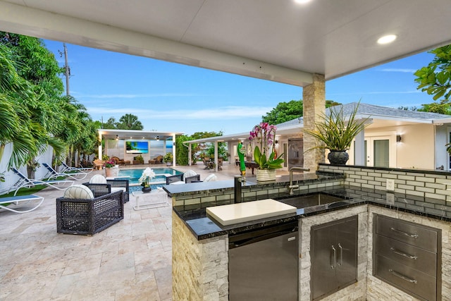 936 Upland Rd, West Palm Beach, FL 33401 - view of patio / terrace with area for grilling and an outdoor pool