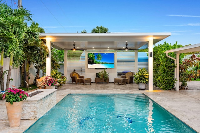 936 Upland Rd, West Palm Beach, FL 33401 - outdoor pool featuring ceiling fan, a patio area, and a fenced backyard