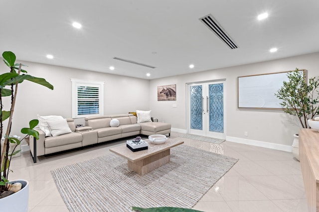 936 Upland Rd, West Palm Beach, FL 33401 - living area with recessed lighting, baseboards, light tile patterned floors, and french doors