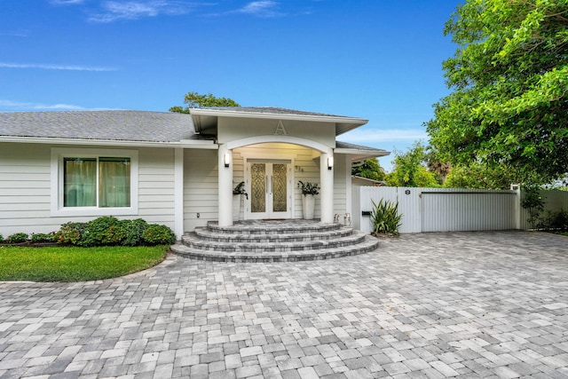 936 Upland Rd, West Palm Beach, FL 33401 - entrance to property with a gate and decorative driveway