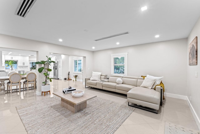 936 Upland Rd, West Palm Beach, FL 33401 - living room featuring light tile patterned floors, baseboards, and recessed lighting