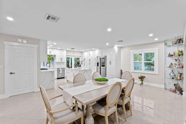 936 Upland Rd, West Palm Beach, FL 33401 - dining room with recessed lighting, light tile patterned floors, and baseboards