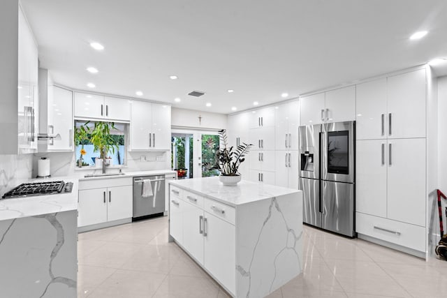 936 Upland Rd, West Palm Beach, FL 33401 - kitchen featuring appliances with stainless steel finishes, modern cabinets, a sink, white cabinets, and recessed lighting
