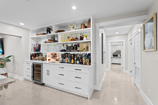 936 Upland Rd, West Palm Beach, FL 33401 - indoor dry bar with beverage cooler, baseboards, and recessed lighting
