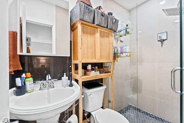 936 Upland Rd, West Palm Beach, FL 33401 - bathroom with a sink, a shower stall, and toilet