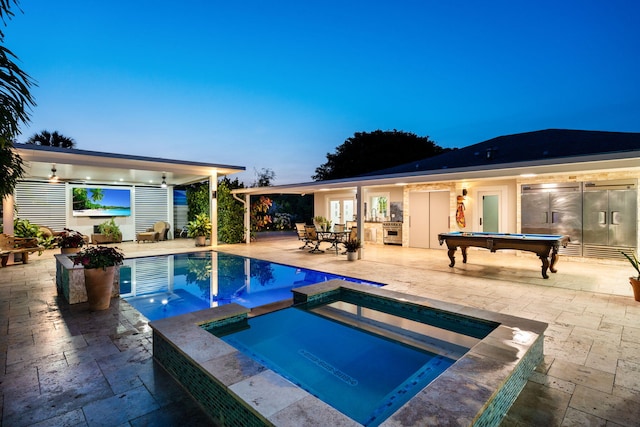 936 Upland Rd, West Palm Beach, FL 33401 - view of pool with a patio area, french doors, and a pool with connected hot tub