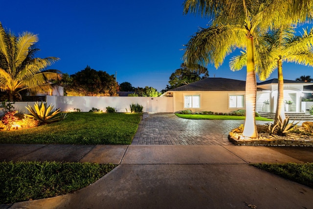 936 Upland Rd, West Palm Beach, FL 33401 - view of front of property featuring decorative driveway and a gate