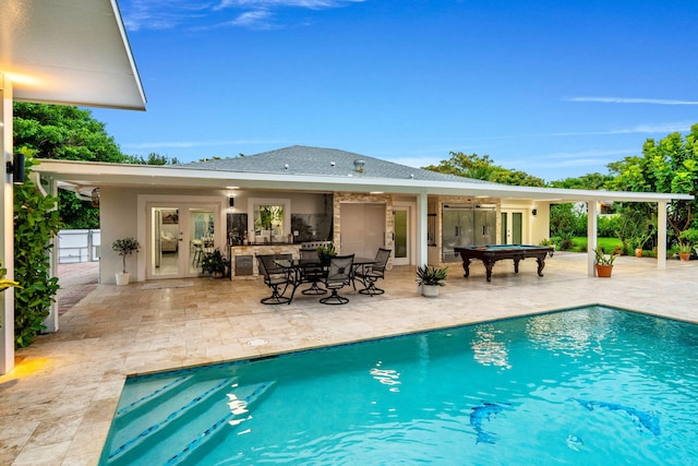 936 Upland Rd, West Palm Beach, FL 33401 - swimming pool featuring french doors and a patio area