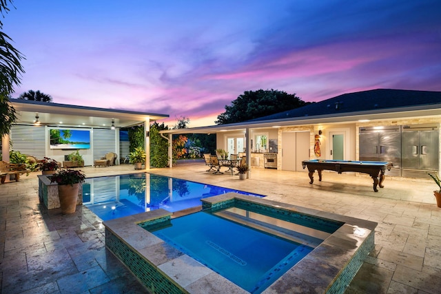 936 Upland Rd, West Palm Beach, FL 33401 - view of swimming pool with a patio, french doors, and a pool with connected hot tub